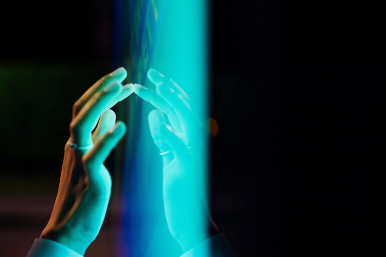 Ey woman touching kiosk screen at night v2.jpg